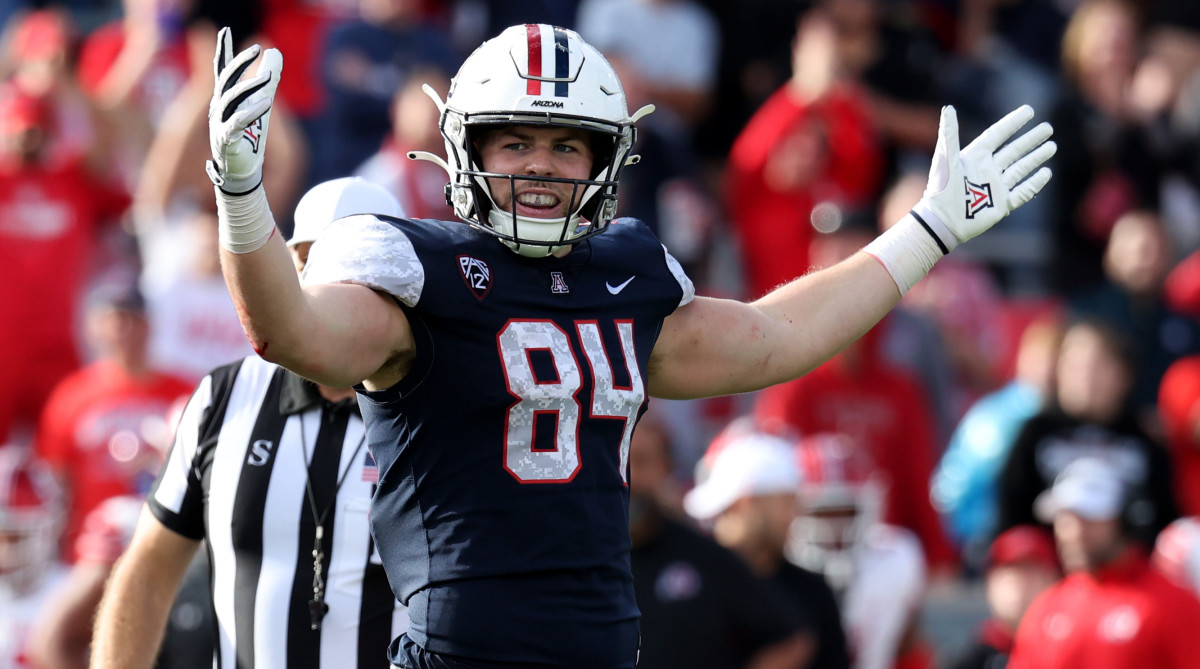 Arizona tight end Tanner McLachlan holds his hands out to celebrate a touchdown