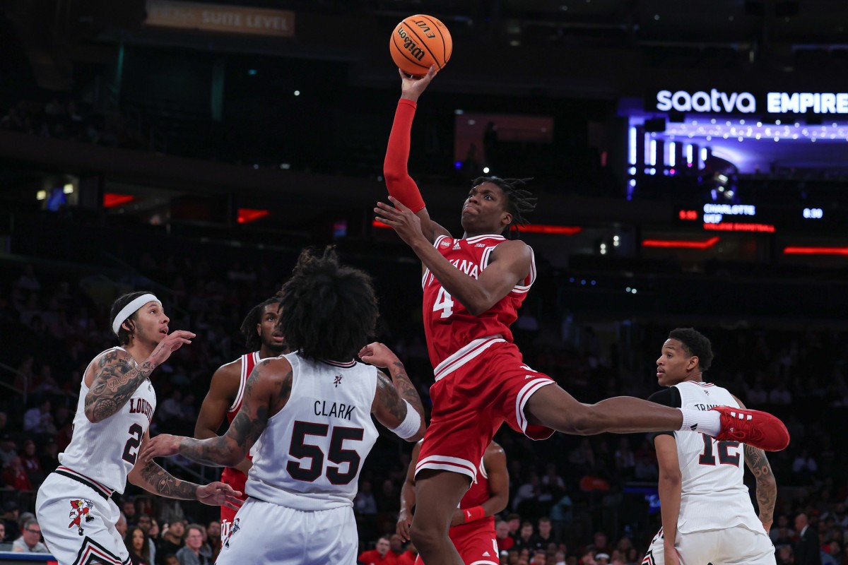 Indiana Hoosiers forward Anthony Walker (4) shoots the ball as Louisville Cardinals guard Skyy Clark (55) defends during the second half at Madison Square Garden.