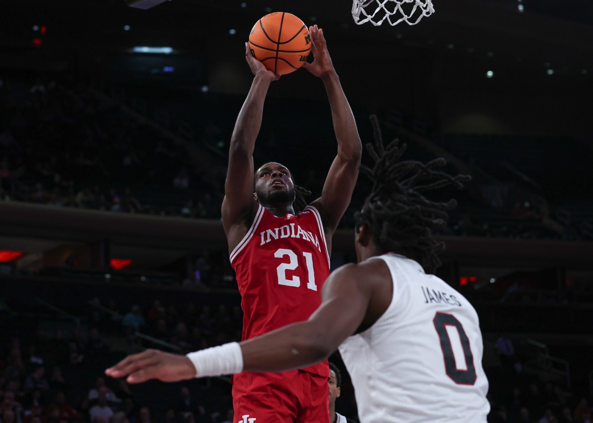 Indiana Hoosiers forward Mackenzie Mgbako (21) shoots the ball as Louisville Cardinals guard Mike James (0) defends during the second half at Madison Square Garden.