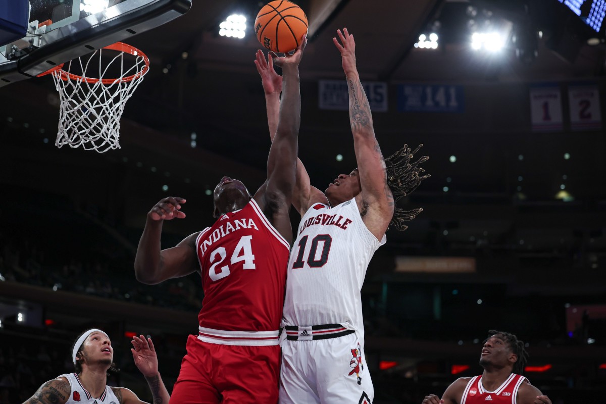  Indiana Hoosiers forward Payton Sparks (24) battles for a rebound against Louisville Cardinals forward Kaleb Glenn (10) during the second half at Madison Square Garden.