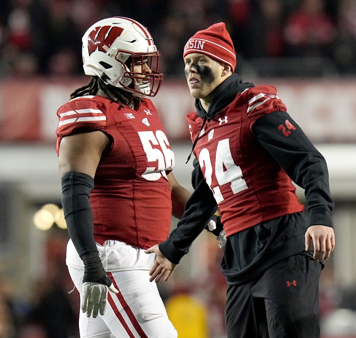 Injured Wisconsin safety Hunter Wohler (24) encourages his teammates during the fourth quarter of their game Saturday, November 18, 2023 at Camp Randall Stadium in Madison, Wisconsin. Wisconsin beat Nebraska 24-17 in overtime.