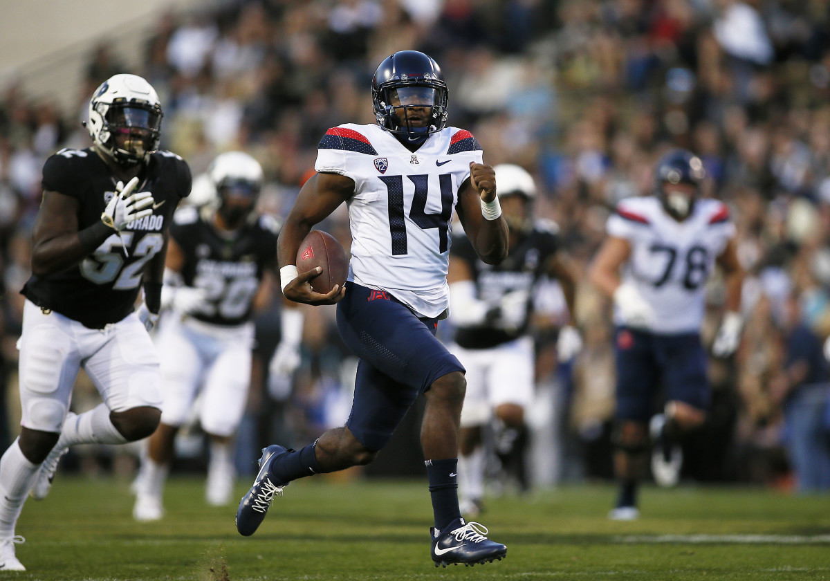 Oct 7, 2017; Boulder, CO, USA; Arizona Wildcats quarterback Khalil Tate (14) runs for a first quarter touchdown against the Colorado Buffaloes at Folsom Field. Mandatory Credit: Russell Lansford-USA TODAY Sports 