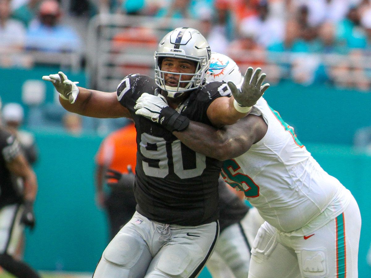 There is a slight chance that the refs may have missed a holding call here (above) on the Miami Dolphins against Jerry Tiller of the Las Vegas Raiders on Sunday.