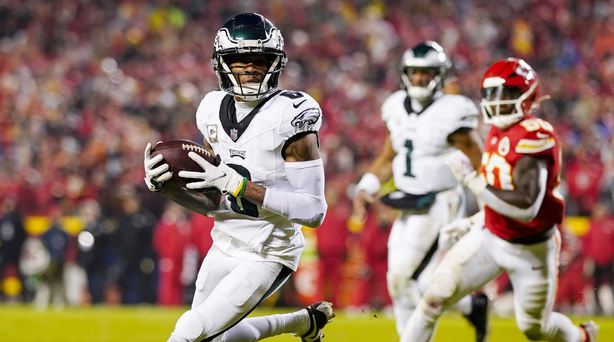 Eagles wide receiver DeVonta Smith, left, runs with the ball against the Chiefs