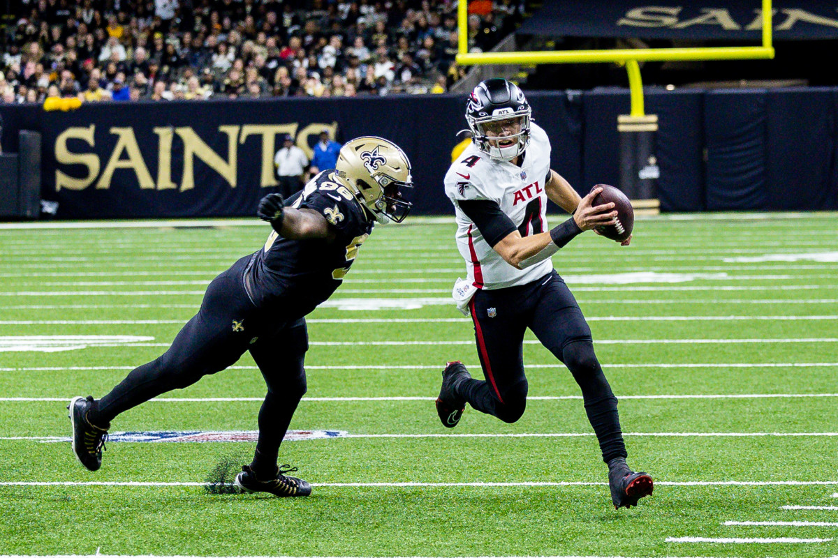 Dec 18, 2022; New Orleans, Louisiana, USA; New Orleans Saints defensive end Payton Turner (98) chases Atlanta Falcons quarterback Desmond Ridder (4) out the pocket during the second half at Caesars Superdome.