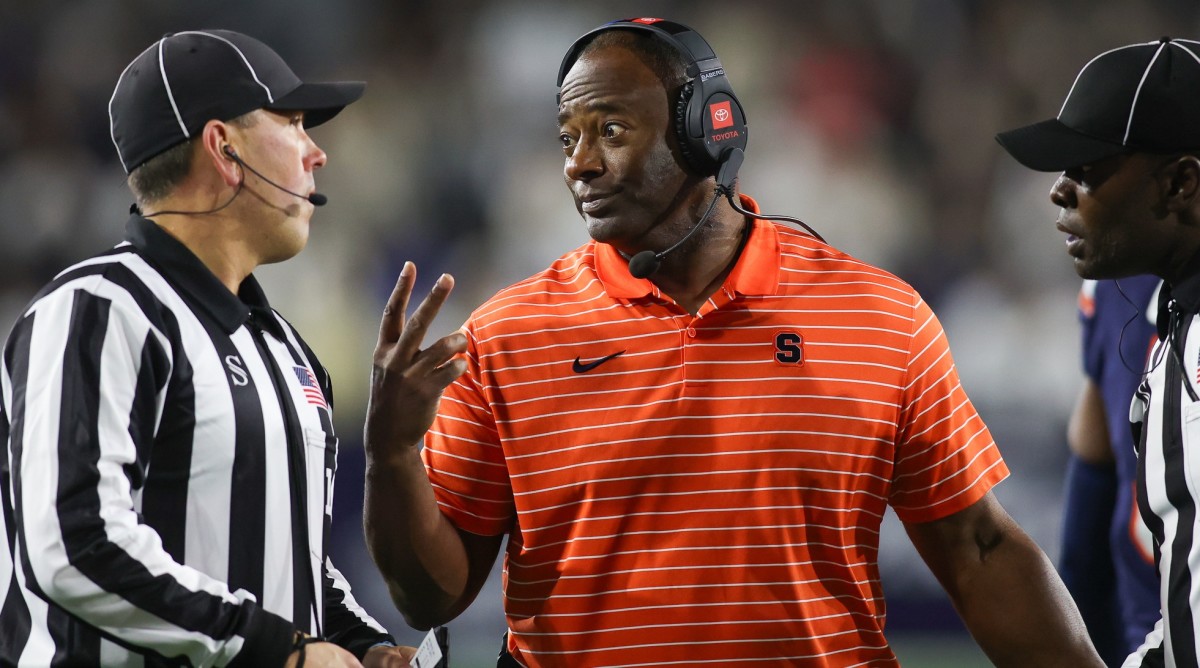 Syracuse football coach Dino Babers talks to a referee during a game against Georgia Tech.