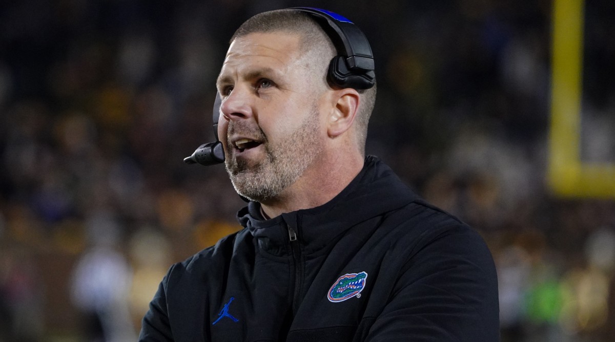 Florida football coach Billy Napier watches the scoreboard during a game against Missouri.
