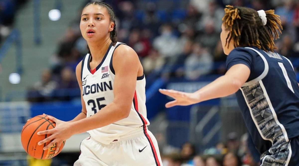 UConn guard Azzi Fudd looks to pass the ball in a game vs. Georgetown.