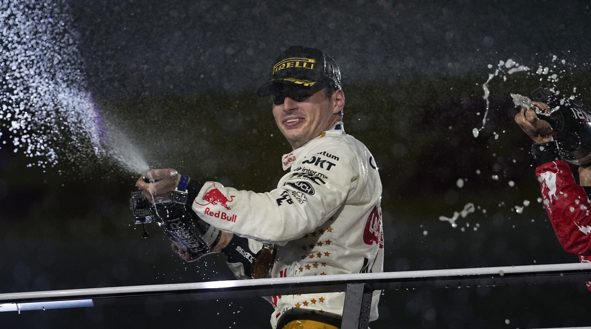 Red Bull driver Max Verstappen sprays champagne on the podium after winning the Formula One Las Vegas Grand Prix.