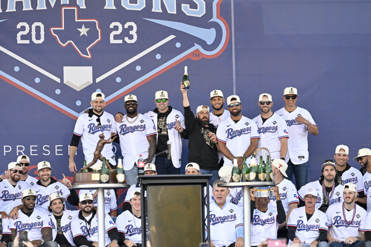The Texas Rangers pose for a photo during the celebration outside of the ballpark after the World Series championship parade at Globe Life Field.