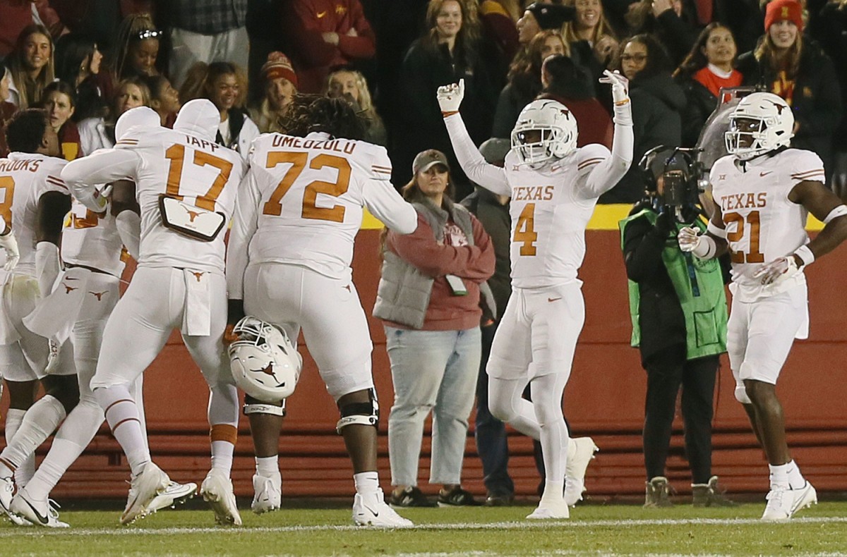 Texas Longhorns special team member Austin Jordan (4) celebrates after blocking a field goal and running back for a two-point score against Iowa State during the third quarter in the Big-12 football showdown at Jack Trice Stadium on Saturday, Nov. 18, 2023, in Ames, Iowa.