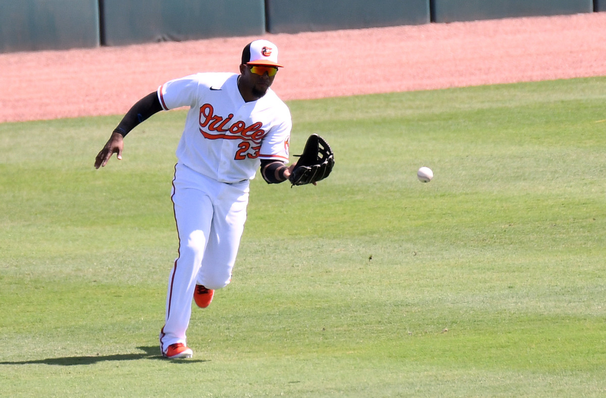 Baltimore Orioles outfielder Yusniel Díaz fields the ball in the first inning against the New York Yankees during spring training. (2021)