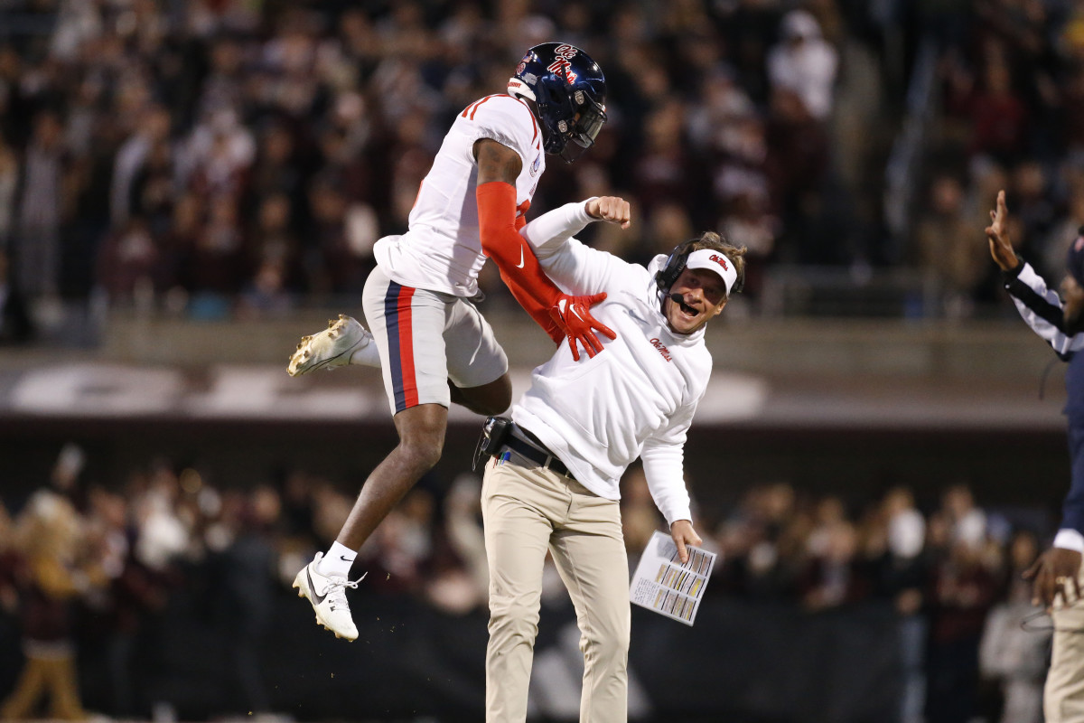 Lane Kiffin (right) and Zamari Walton celebrate during Ole Miss' 17-7 win over rival Mississippi State in the Egg Bowl.