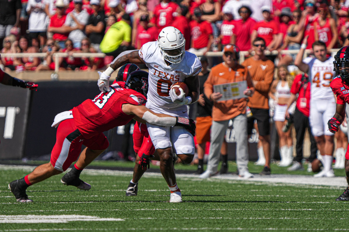 Sep 24, 2022; Lubbock, Texas, USA; Texas Longhorns tight end Ja'Tavion Sanders is tackled by Texas Tech Red Raiders linebacker Jacob Rodriguez (13) during a game at Jones AT&T Stadium. 