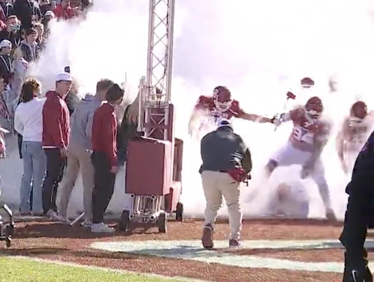 Isaiah Coe (94) steps over Brent Venables