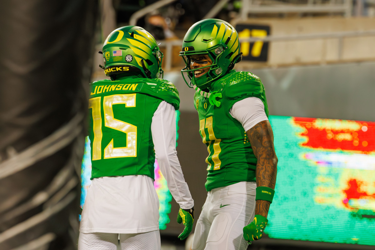 Oregon Ducks wide receivers Troy Franklin (11) and Tez Johnson (15) celebrate a touchdown against the Oregon State Beavers.