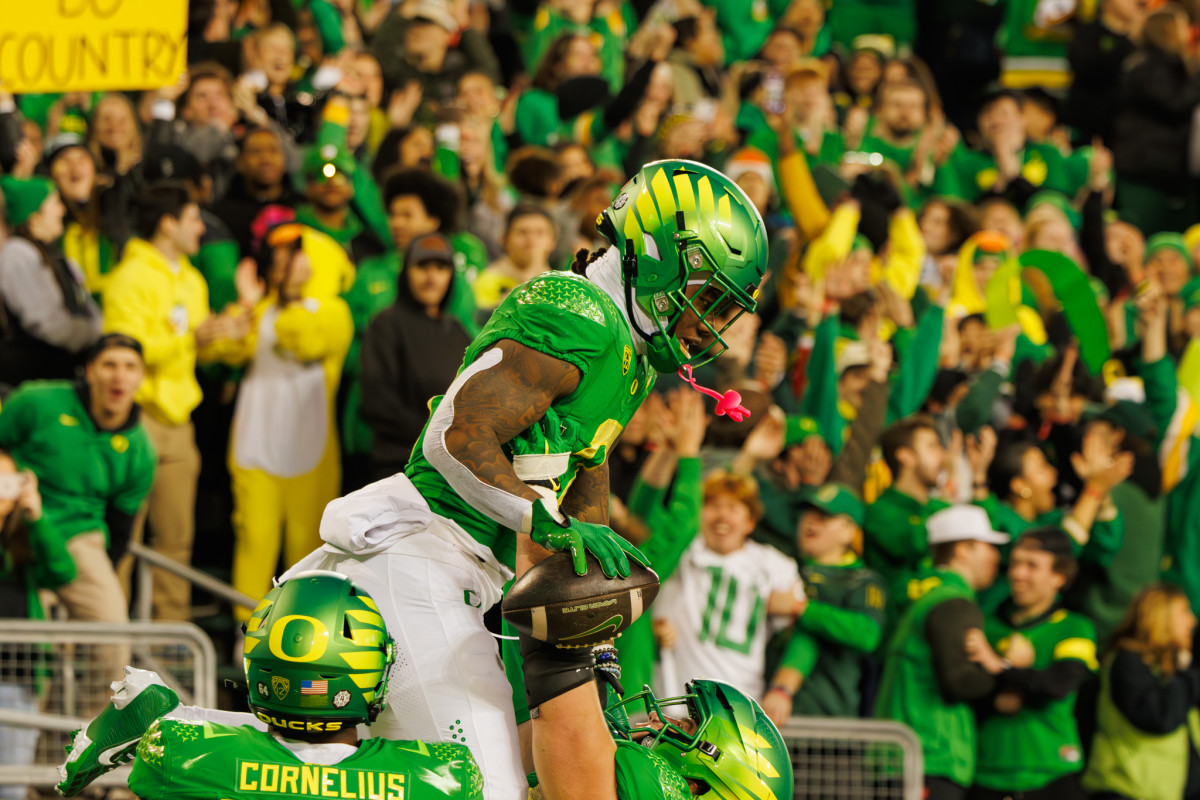 Oregon Ducks running back Bucky Irving celebrates a touchdown against the Oregon State Beavers.