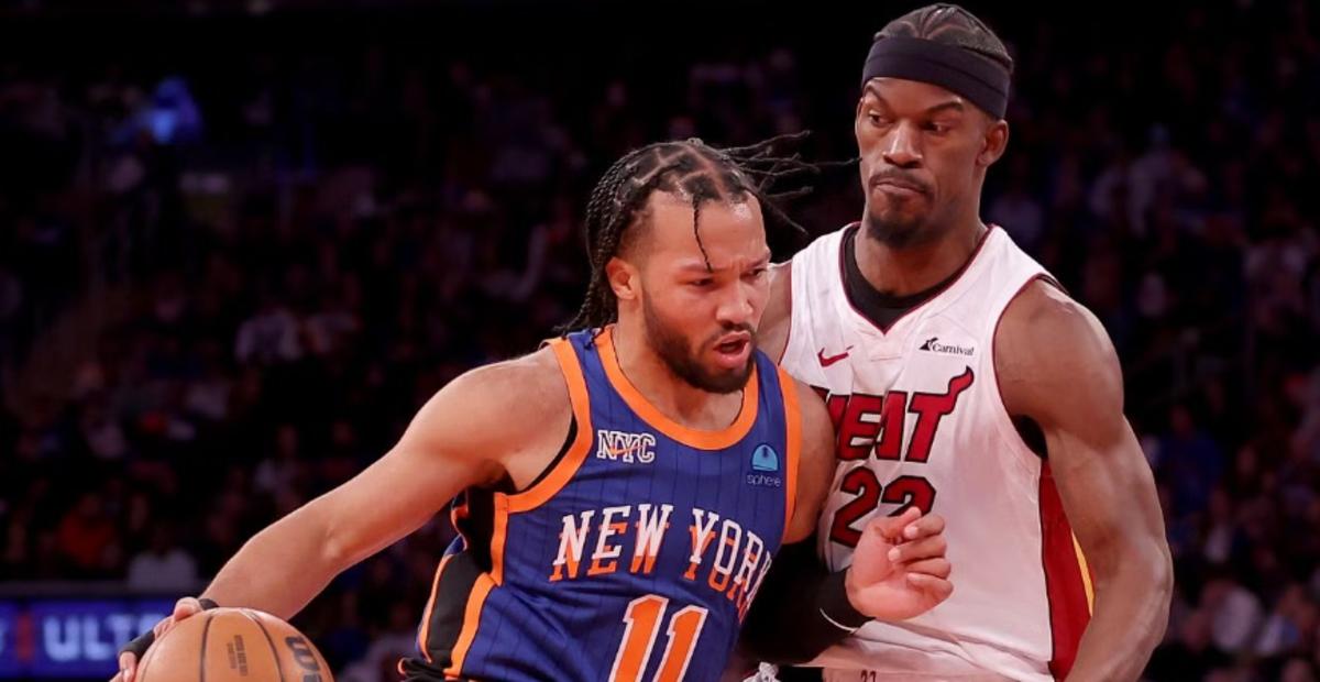 New York Knicks guard Jalen Brunson defended by Miami Heat All-Star Jimmy Butler.