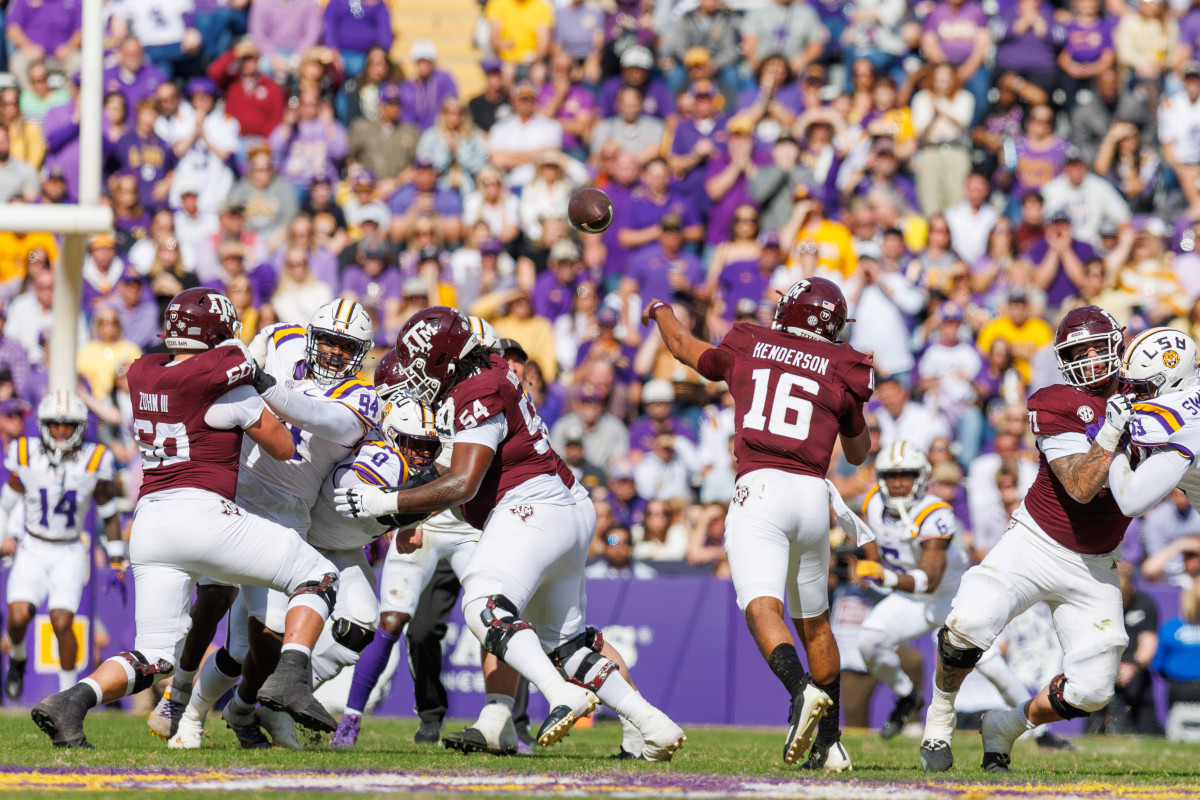 Texas A&M Aggies quarterback Jaylen Henderson (16) passes the ball against the LSU Tigers during the first half at Tiger Stadium.