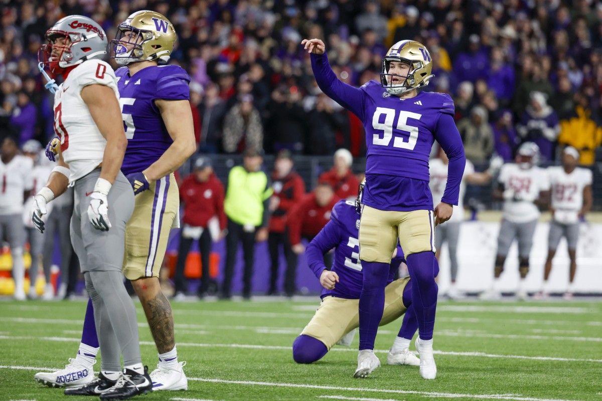 Grady Gross watches his game-winning 42-yard field goal sail through the uprights at the Apple Cup.
