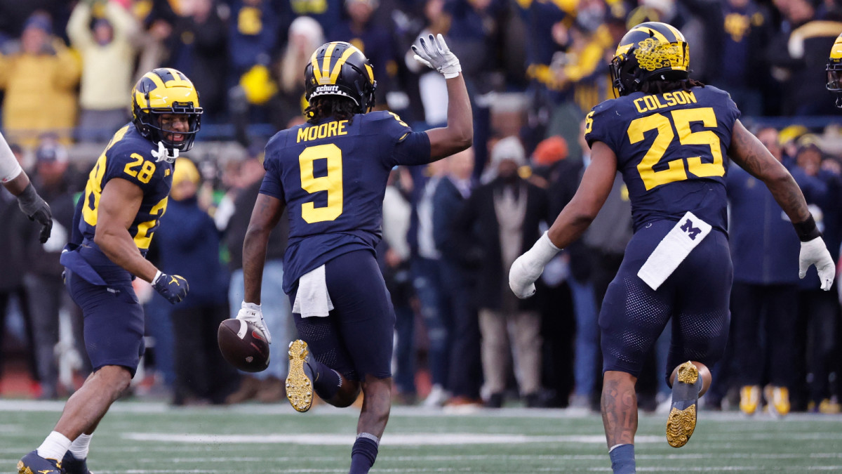 Nov 25, 2023; Ann Arbor, Michigan, USA; Michigan Wolverines defensive back Rod Moore (9) celebrates after he makes an interception in the second half against the Ohio State Buckeyes at Michigan Stadium.