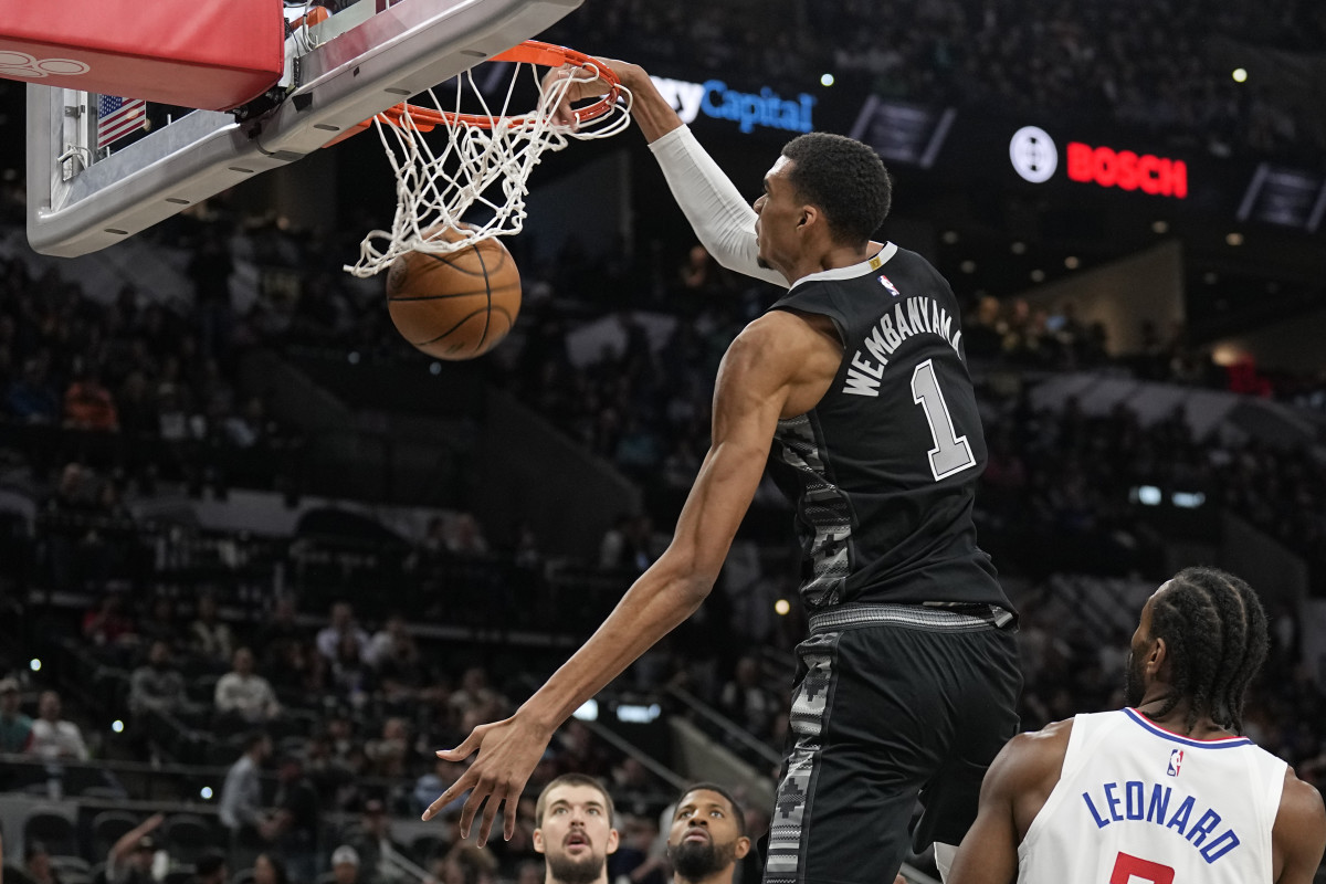 Nov 22, 2023; San Antonio, Texas, USA; San Antonio Spurs forward Victor Wembanyama (1) dunks during the second half against the Los Angeles Clippers at Frost Bank Center.