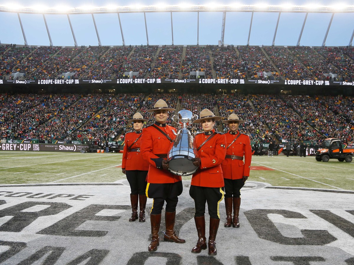 Nov 25, 2018; Edmonton, Alberta, CAN; Canadian Mounted Police pose with the Grey Cup during pre game of the 106th Grey Cup game between the Ottawa Redblacks and Calgary Stampeders at The Brick Field at Commonwealth Stadium. Calgary defeated Ottawa. Mandatory Credit: John E. Sokolowski-USA TODAY Sports