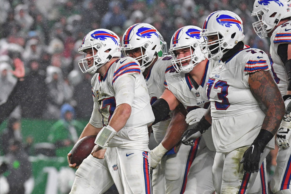 Allen and his linemen celebrate a big play against the Philadelphia Eagles.