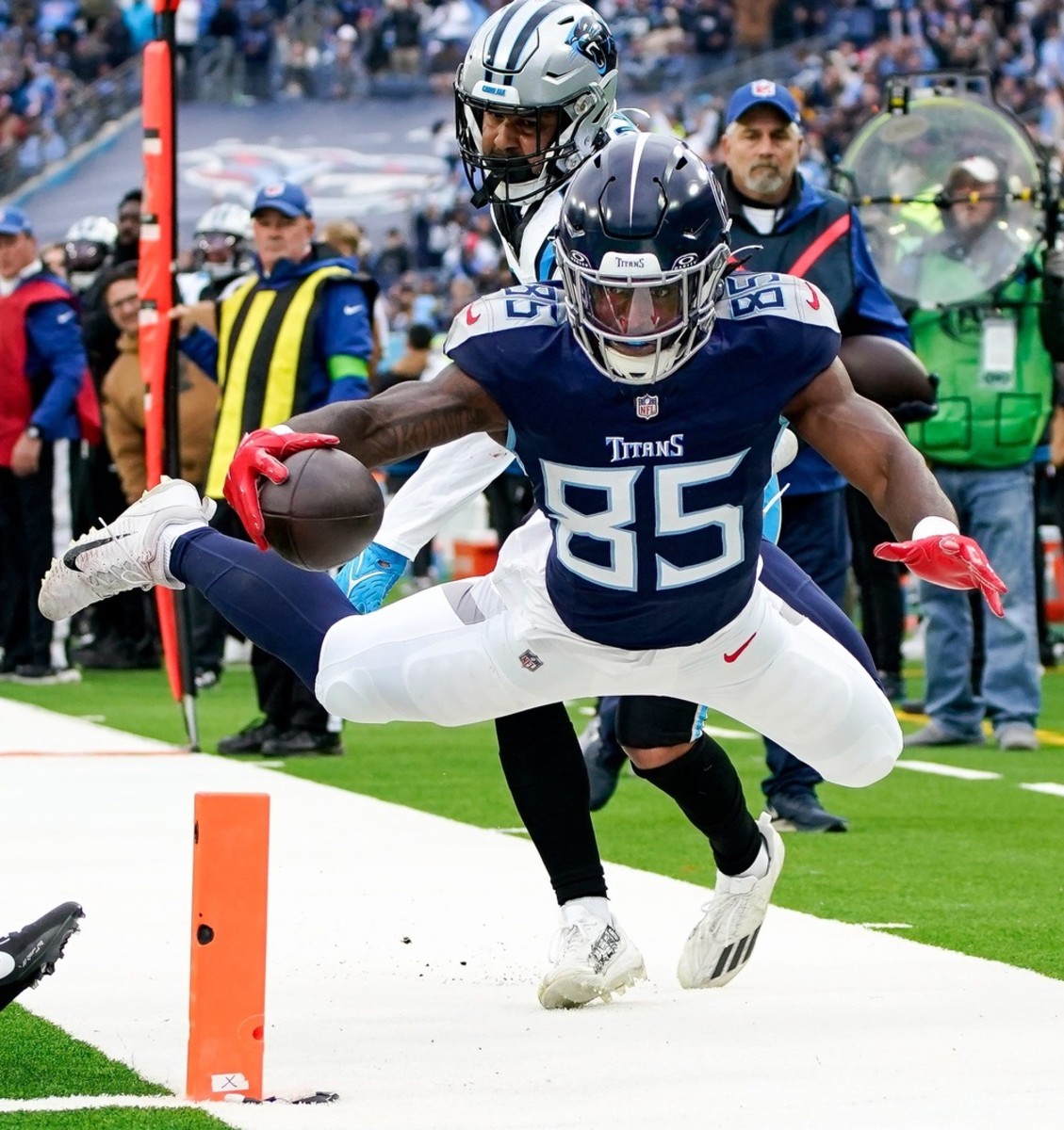 Tennessee Titans tight end Chigoziem Okonkwo (85) is pushed out of bounds at the one yard line by Carolina Panthers linebacker Kamu Grugier-Hill (54) during the first quarter at Nissan Stadium in Nashville, Tenn., Sunday, Nov. 26, 2023.