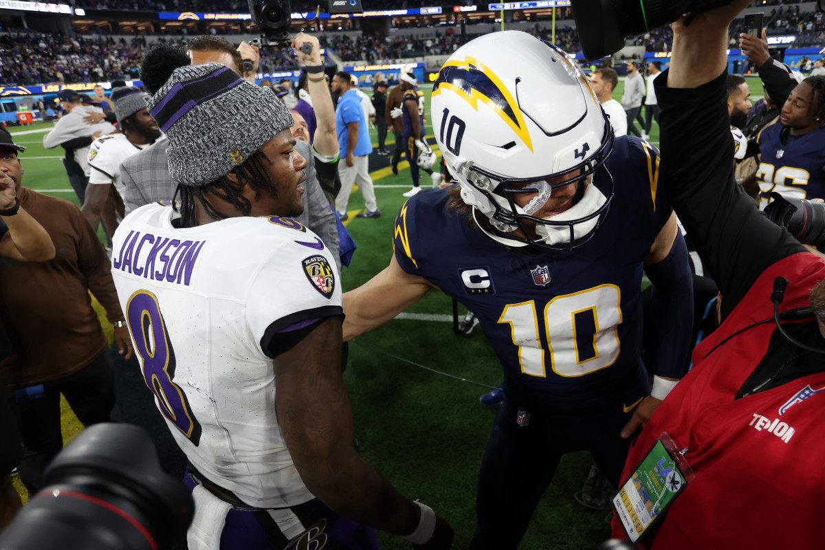 Baltimore Ravens quarterback Lamar Jackson greets Los Angeles Chargers quarterback Justin Herbert after defeating the Chargers 20-10 at SoFi Stadium.