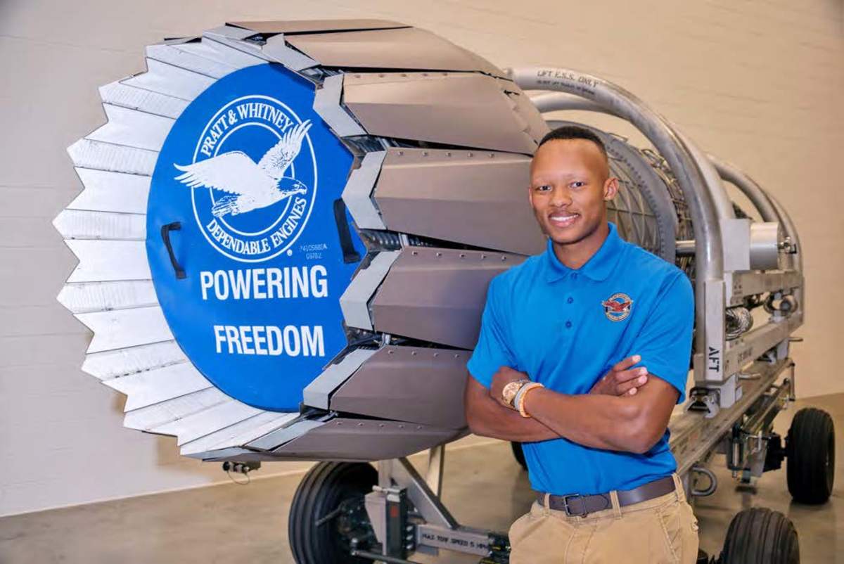 Joshua Dobbs wearing a polo shirt and posing on the job as an engineer.
