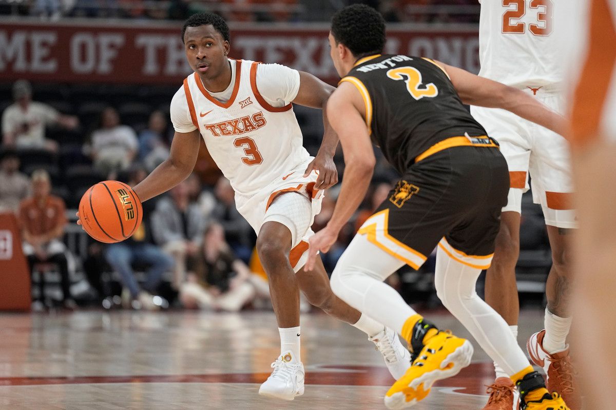 Texas Longhorns guard Max Abmas (3) looks to pass the ball during the first half against the Wyoming Cowboys at Moody Center.