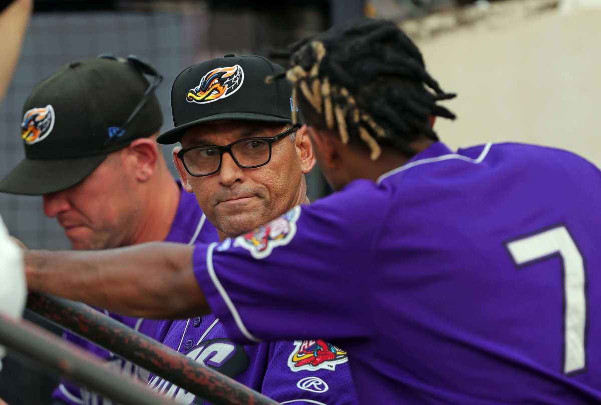 Akron RubberDucks manager Rouglas Odor, facing, speaks with Jose Tena during the fourth inning of a minor league baseball game against the Binghamton Rumble Ponies at Canal Park, Tuesday, June 20, 2023, in Akron, Ohio.