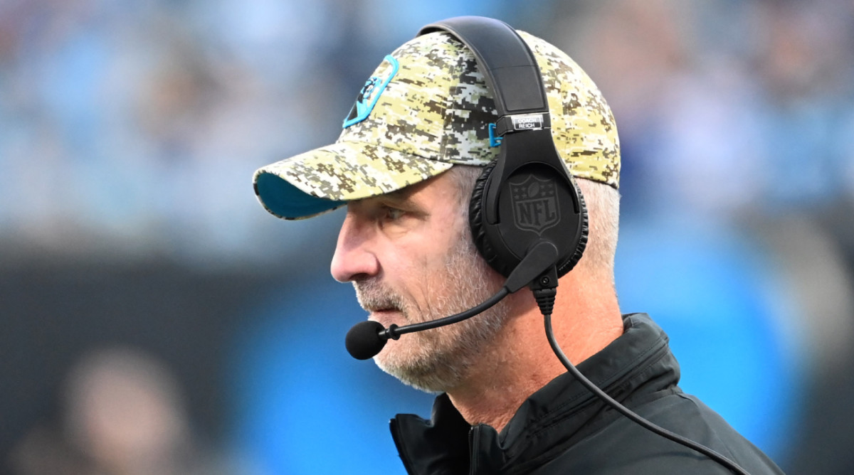Panthers coach Frank Reich stands on the sidelines during a game.