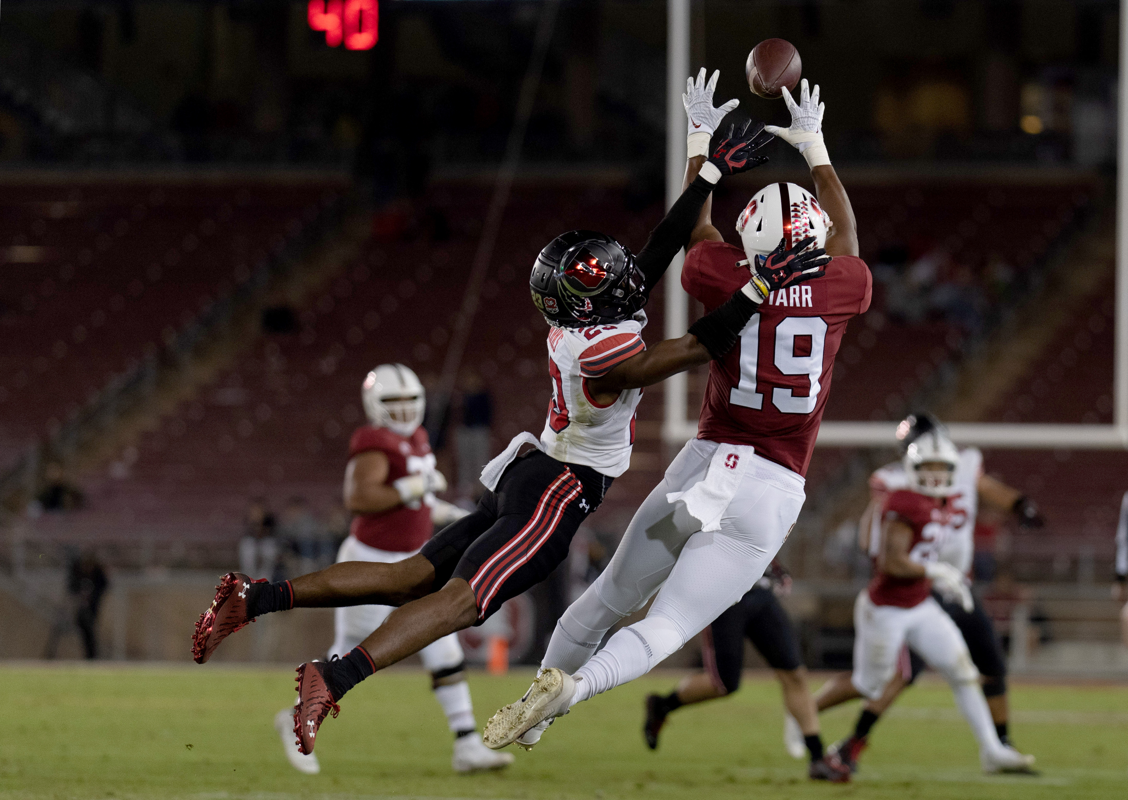 Nov 5, 2021; Stanford, California, USA; Utah Utes cornerback Faybian Marks (23) attempts to defend against Stanford Cardinal wide receiver Silas Starr (19) during the fourth quarter at Stanford Stadium. Mandatory Credit: Stan Szeto-USA TODAY Sports