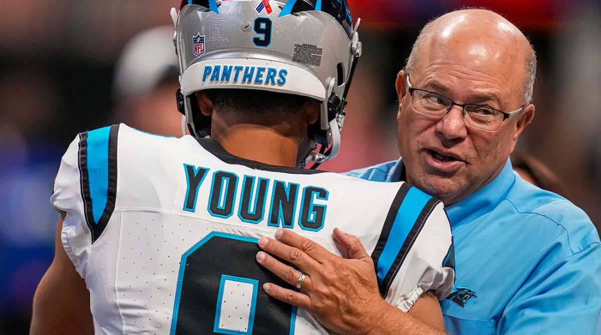 Panthers owner David Tepper pats QB Bryce Young on the back