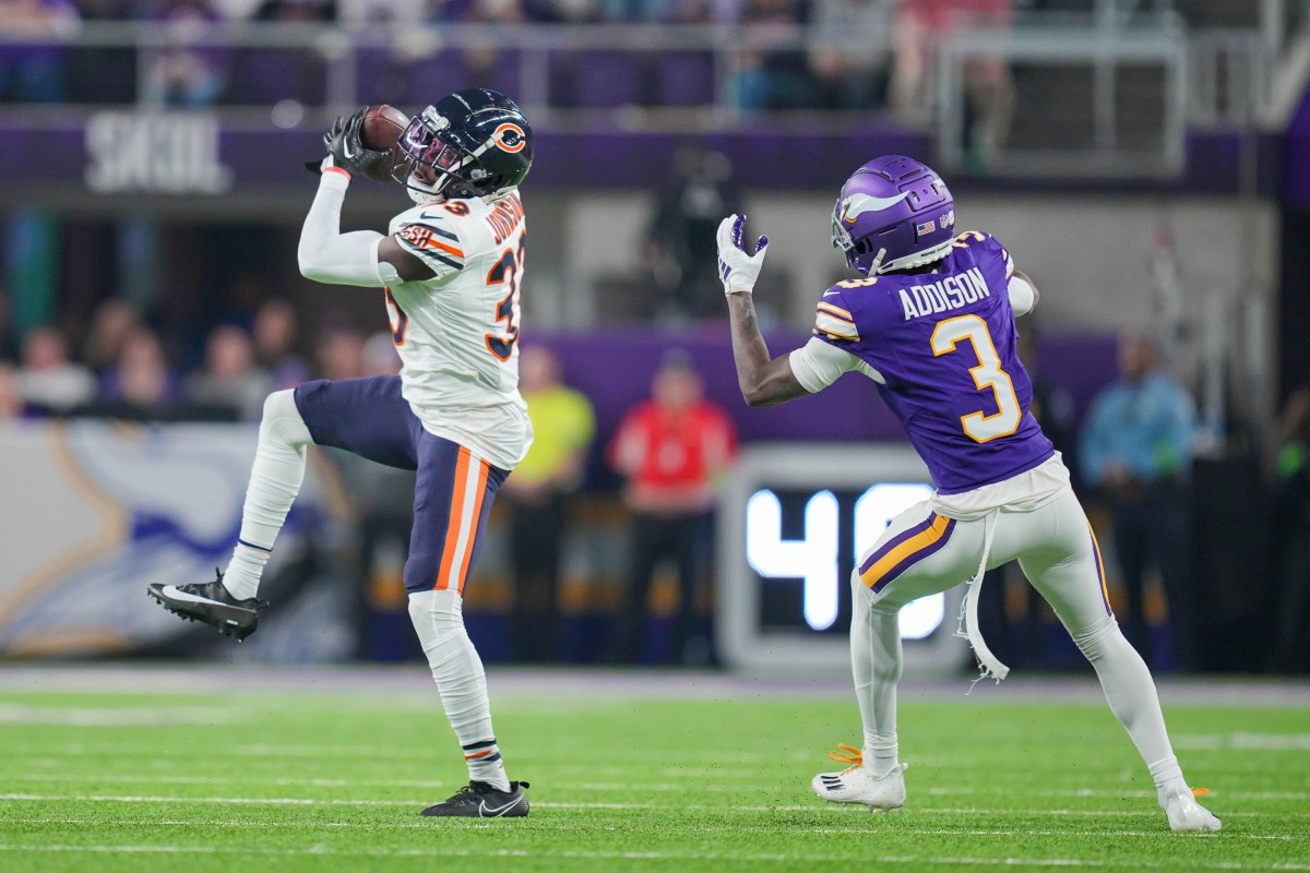 Nov 27, 2023; Minneapolis, Minnesota, USA; Chicago Bears cornerback Jaylon Johnson (33) intercepts a pass intended for Minnesota Vikings wide receiver Jordan Addison (3) in the second quarter at U.S. Bank Stadium. 