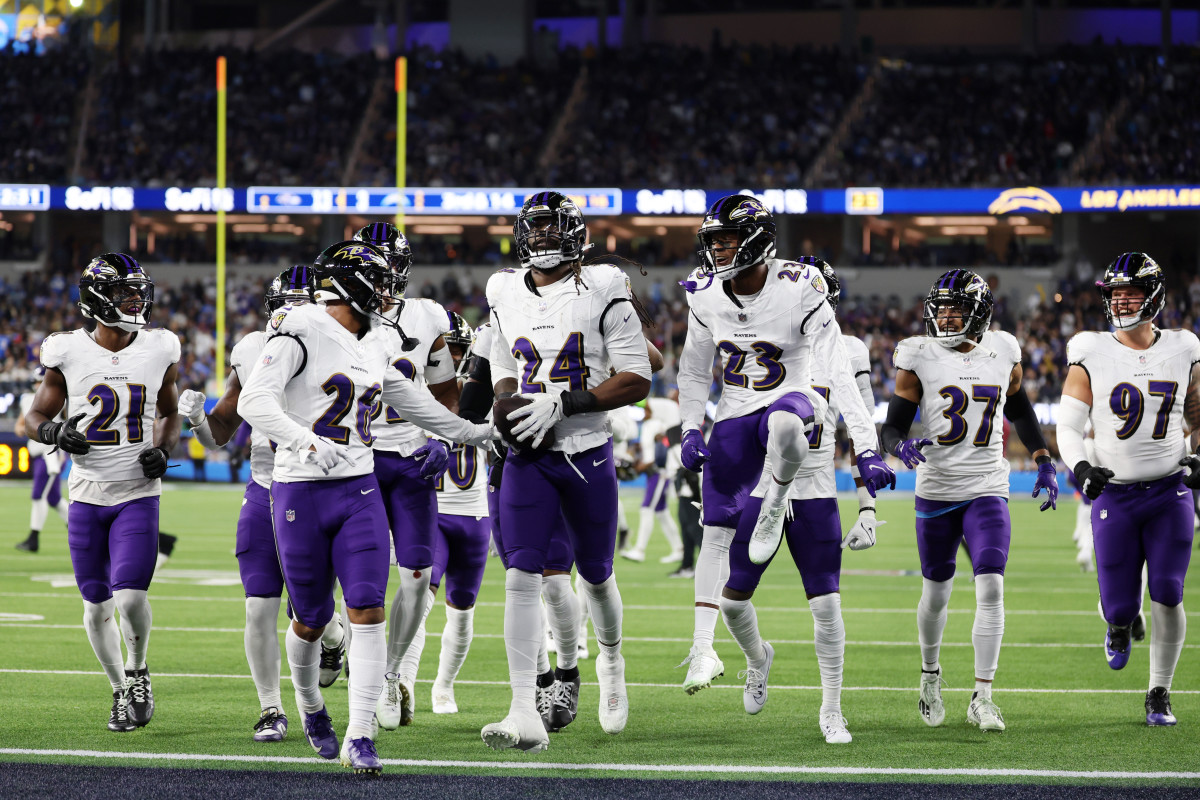 Nov 26, 2023; Inglewood, California, USA; Baltimore Ravens linebacker Jadeveon Clowney (24) celebrates with his teammates after recovering a fumble against the Los Angeles Chargers during the fourth quarter at SoFi Stadium. Mandatory Credit: Kiyoshi Mio-USA TODAY Sports