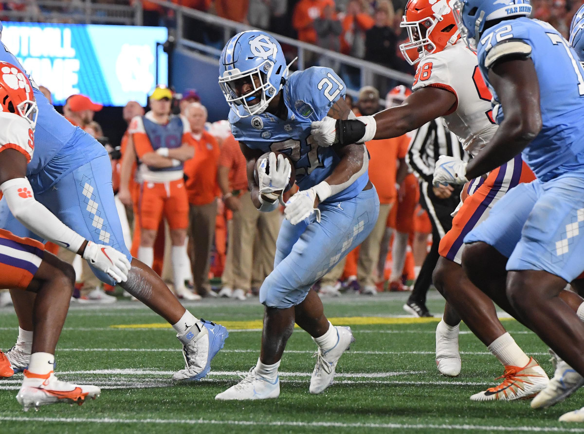 North Carolina RB Elijah Green trying to break a tackle against Clemson in the 2022 ACC Title Game (3rd Dec., 2022)