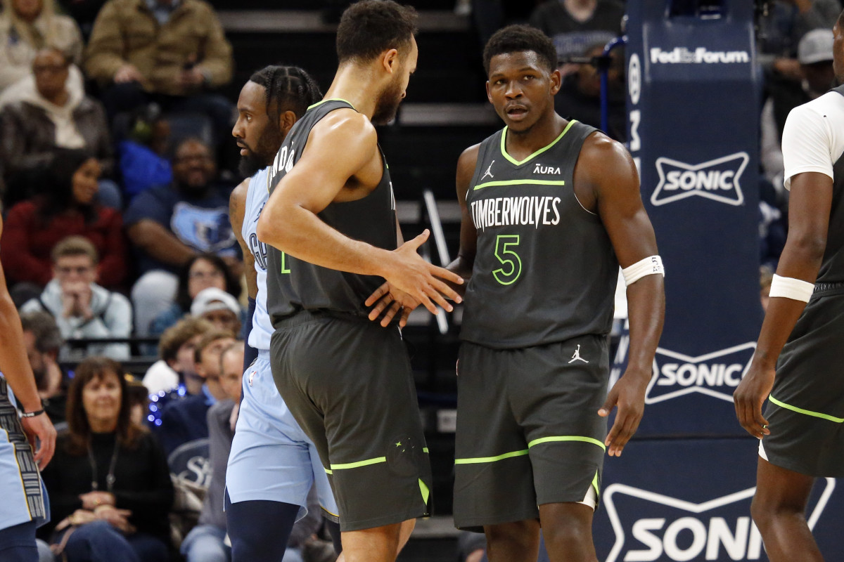 Nov 26, 2023; Memphis, Tennessee, USA; Minnesota Timberwolves guard Anthony Edwards (5) reacts with forward-guard Kyle Anderson (1) during the second half against the Memphis Grizzlies at FedExForum. 