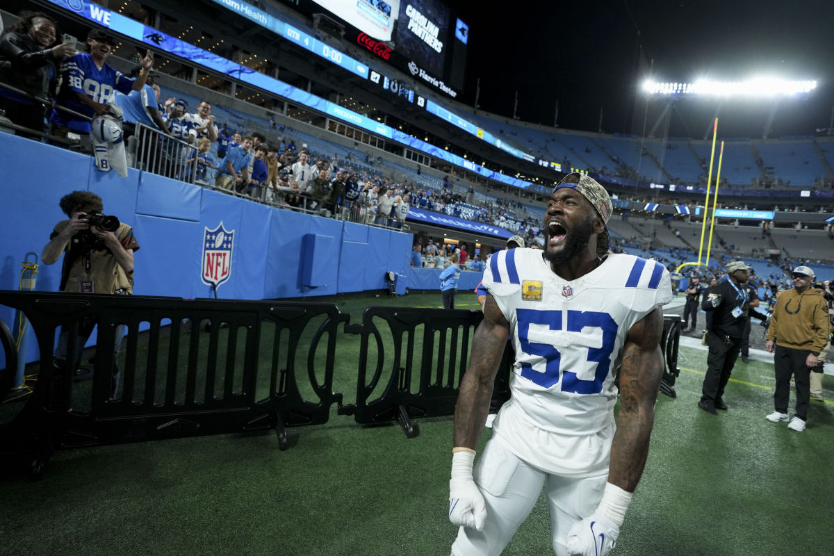 Shaq Leonard flexes his arms down by his side as he yells near the side of the stadium