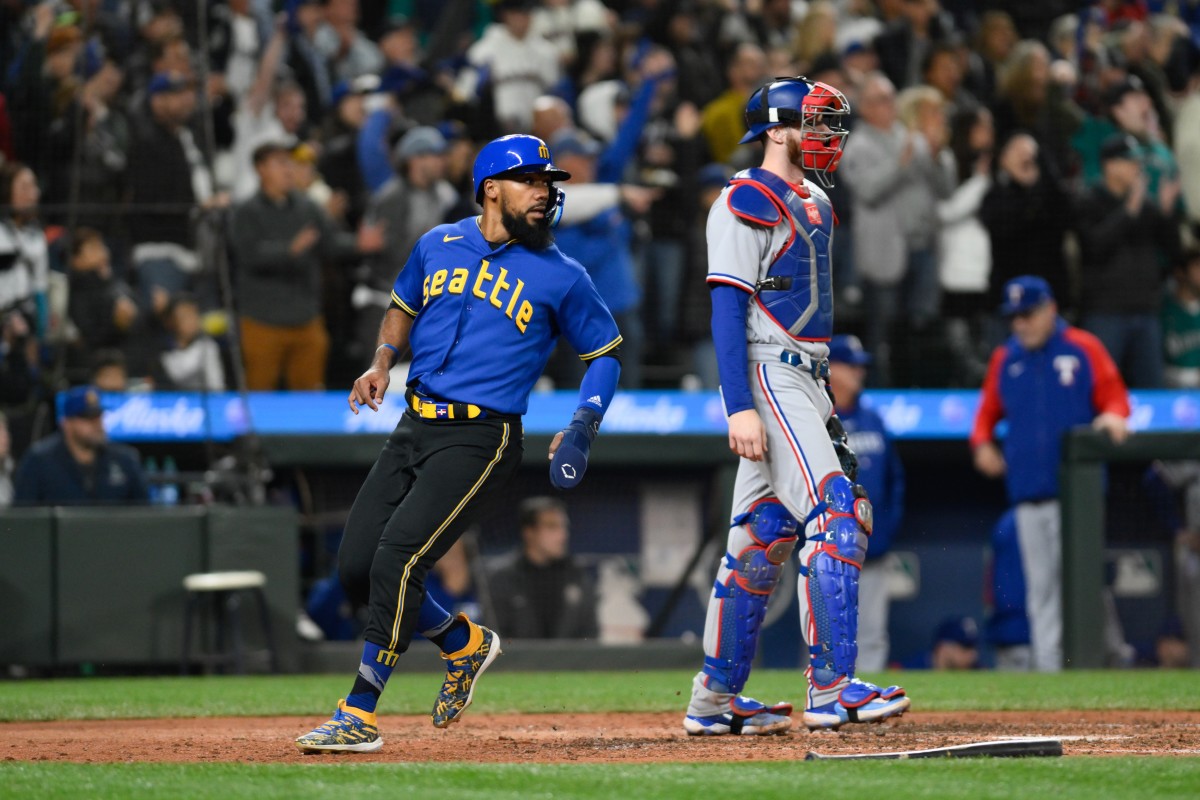 Sep 29, 2023; Seattle, Washington, USA; Seattle Mariners right fielder Teoscar Hernandez (35) scores a run against the Texas Rangers during the fourth inning at T-Mobile Park. Mandatory Credit: Steven Bisig-USA TODAY Sports  