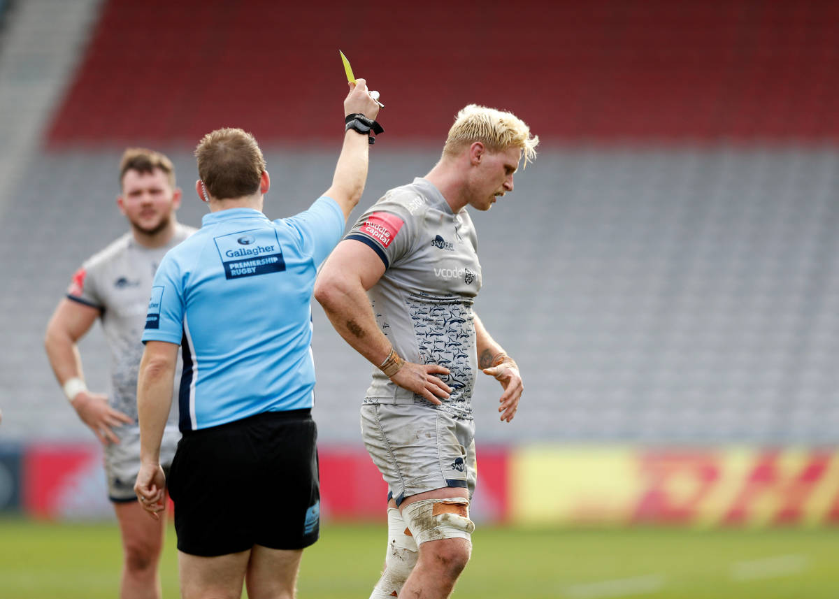 Rugby referee Ian Tempest pictured showing a yellow card to Jean-Luc Du Preez to send him to the sin bin during a game in February 2021
