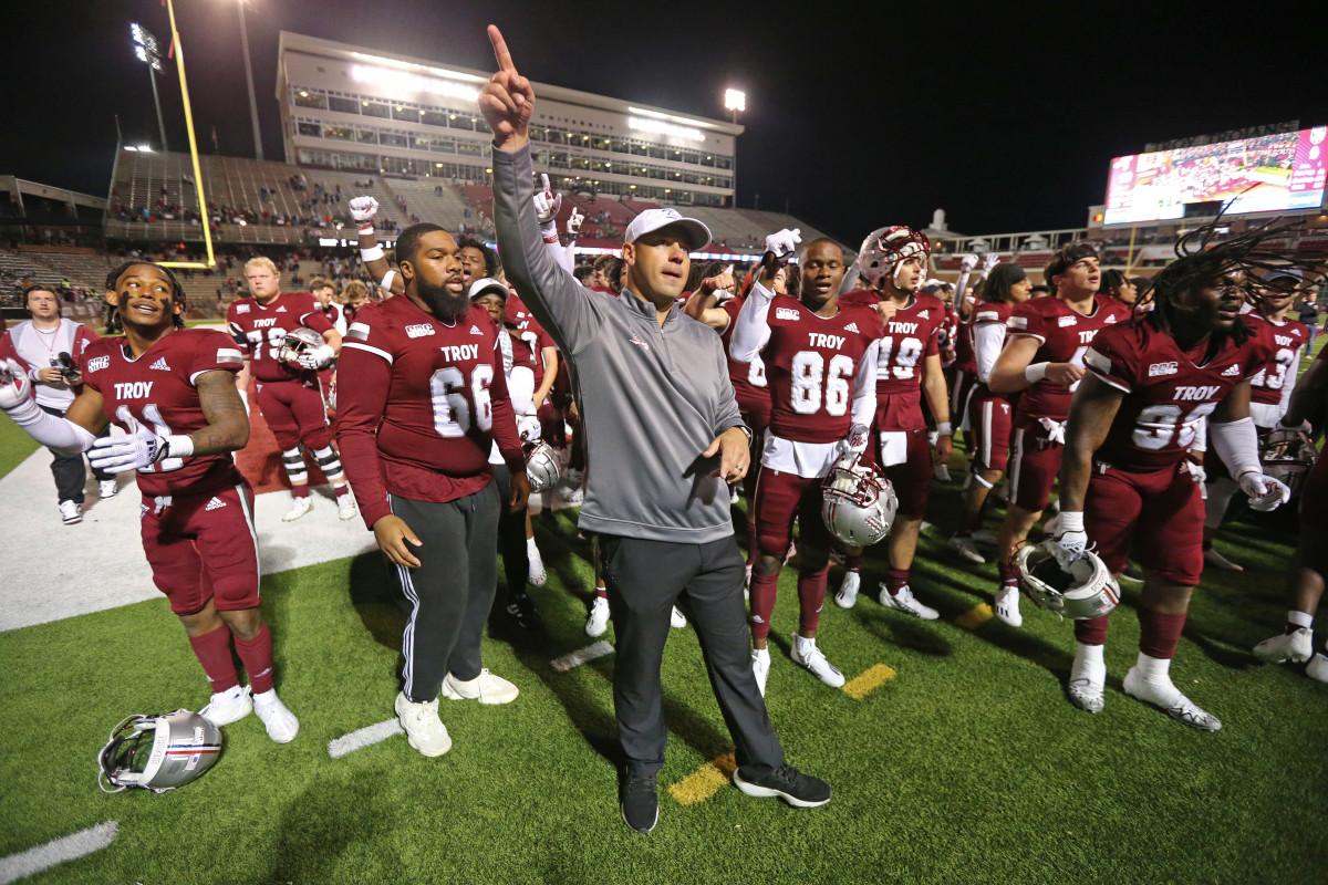 Nov 12, 2022; Troy, Alabama, USA; Troy Trojans head coach Jon Sumrall celebrates with his team after a 10-9 victory against the Army Black Knights at Veterans Memorial Stadium. Mandatory Credit: Danny Wild-USA TODAY Sports