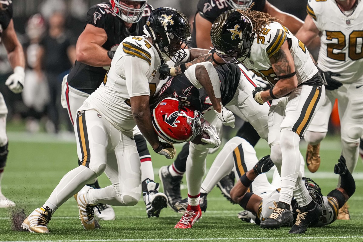 Atlanta Falcons running back Cordarrelle Patterson (84) is tackled by New Orleans Saints defensive end Cameron Jordan (94) and safety Tyrann Mathieu (32). Mandatory Credit: Dale Zanine-USA TODAY Sports