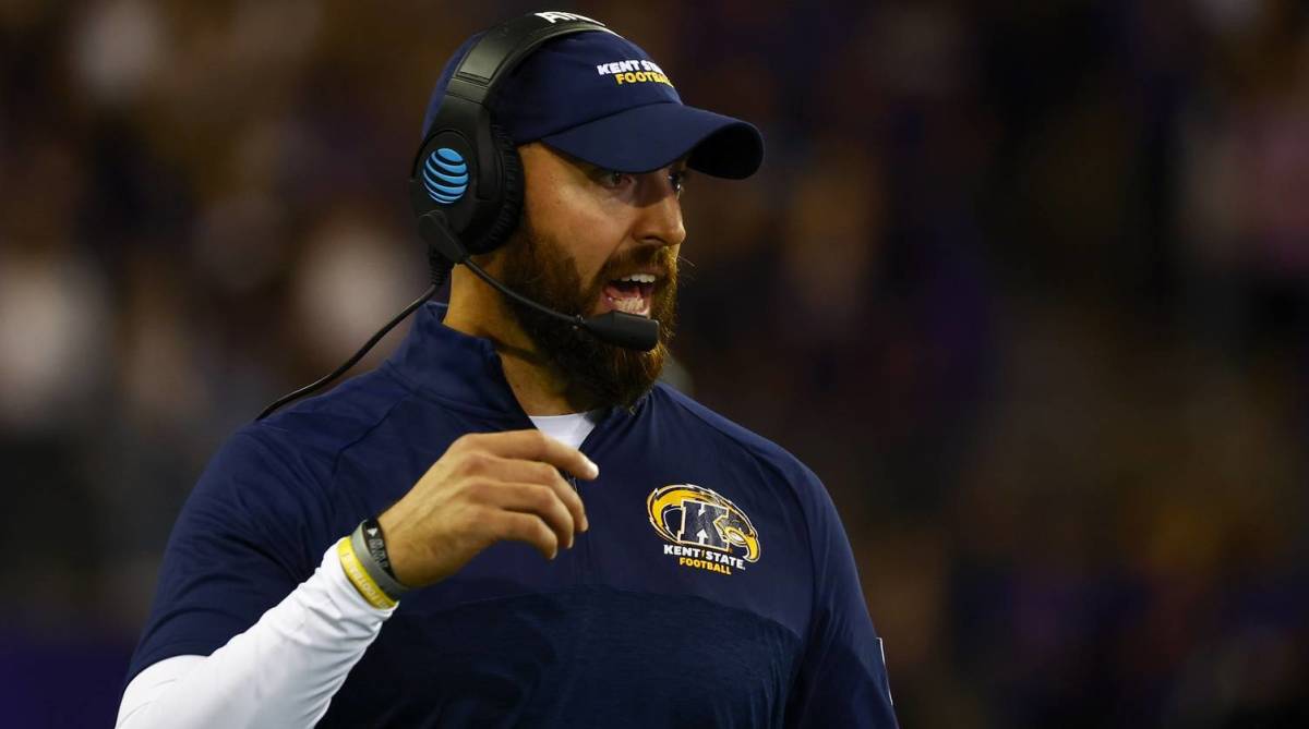 Kent State head coach yells out a play during a game.