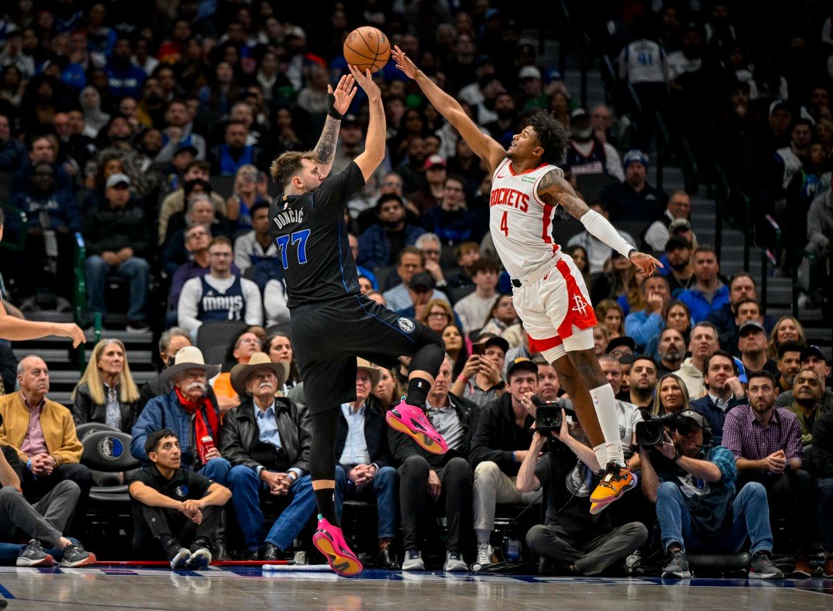 Dallas Mavericks guard Luka Doncic (77) shoots over Houston Rockets guard Jalen Green (4) during the second half at the American Airlines Center.