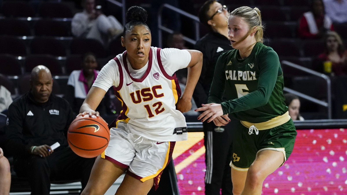 USC guard JuJu Watkins drives to the basket against Cal Poly guard Ania McNicholas during the first half of an NCAA college basketball game, Tuesday, Nov. 28, 2023, in Los Angeles.