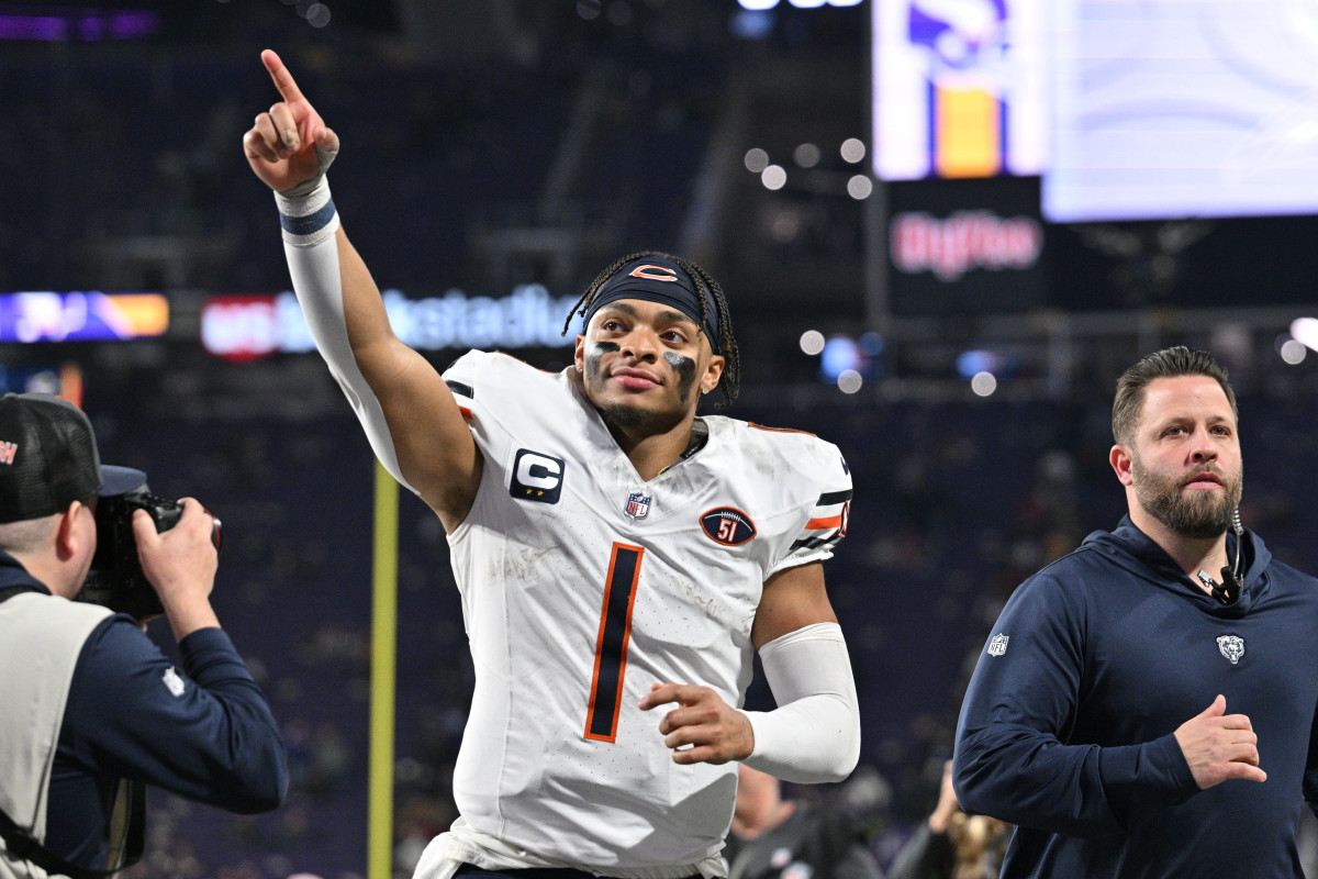 Chicago Bears quarterback Justin Fields runs off the field after beating the Minnesota Vikings last Monday night at U.S. Bank Stadium.