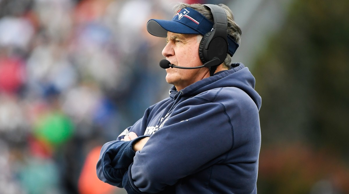 Patriots coach Bill Belichick stands with his arms crossed during a game against the Bills.